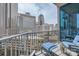 Relaxing balcony with city views, stylish seating, and a modern railing at 210 N Church St # 1507, Charlotte, NC 28202