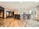 Modern bar area with stool seating and pendant lighting, set on a wood-patterned floor at 210 N Church St # 1507, Charlotte, NC 28202