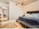 Bright bedroom featuring hardwood floors, recessed lighting, and a modern chandelier at 210 N Church St # 1507, Charlotte, NC 28202