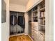 Walk-in closet with custom shelving and built-in storage for shoes and clothing at 210 N Church St # 1507, Charlotte, NC 28202