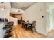 Dining area with hardwood floors and a table with seating for six, adjacent to the kitchen at 210 N Church St # 1507, Charlotte, NC 28202