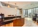 Modern kitchen with granite counters, stainless steel appliances, and a view of the city skyline at 210 N Church St # 1507, Charlotte, NC 28202
