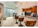 Open kitchen with stainless steel appliances, breakfast bar, and cityscape view at 210 N Church St # 1507, Charlotte, NC 28202
