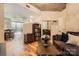 Open-concept living space with hardwood floors and stylish furnishings, leading into the dining area at 210 N Church St # 1507, Charlotte, NC 28202