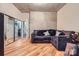 Living room with mirrored closet doors and a cozy brown sectional sofa with decorative pillows at 210 N Church St # 1507, Charlotte, NC 28202