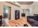 Spacious living room with modern decor, including a display cabinet and a glimpse of the dining area at 210 N Church St # 1507, Charlotte, NC 28202