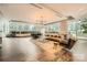 Spacious living room featuring large windows and stylish modern furniture at 210 N Church St # 1507, Charlotte, NC 28202