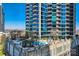 Gorgeous rooftop pool and lounge with modern buildings, blue skies, and cityscape views at 210 N Church St # 1507, Charlotte, NC 28202