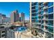 Beautiful rooftop pool and lounge area with city views and modern high-rise building at 210 N Church St # 1507, Charlotte, NC 28202