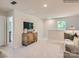 Bright loft area with a TV, comfortable couch, and neutral tones at 2961 Legacy Ridge Ln, Catawba, NC 28609