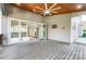 Covered outdoor deck with ceiling fan and a view of the living area through sliding glass doors at 303 Basswood Ct, Clover, SC 29710