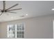 Modern ceiling fan with a light, complemented by recessed lighting and a window at 303 Basswood Ct, Clover, SC 29710