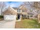 Charming brick and siding home with a two-car garage, well-manicured lawn, and inviting curb appeal at 303 Basswood Ct, Clover, SC 29710