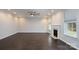 Bright living room features a fireplace, hardwood floors, recessed lighting, and a modern ceiling fan at 303 Basswood Ct, Clover, SC 29710