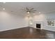 Bright living room features a fireplace, hardwood floors, recessed lighting, and a modern ceiling fan at 303 Basswood Ct, Clover, SC 29710