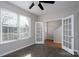 Versatile office space with a window, French doors to another room and a ceiling fan, offering flexibility at 303 Basswood Ct, Clover, SC 29710