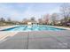 The sparkling community pool features a shallow area, is fenced, and has clear skies above at 303 Basswood Ct, Clover, SC 29710