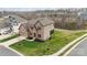 Aerial view of home featuring well-manicured lawn, brick and siding exterior, and attached garage at 3045 Bronwood Pl, Lancaster, SC 29720
