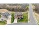 Aerial view of home with lush lawn, brick facade, and wide driveway at 3045 Bronwood Pl, Lancaster, SC 29720