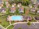 Aerial view of homes, pools, and community amenities in a well-maintained neighborhood at 3045 Bronwood Pl, Lancaster, SC 29720