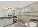Modern bathroom featuring a glass-enclosed shower and a vanity with a dark countertop and storage at 3045 Bronwood Pl, Lancaster, SC 29720