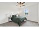 Cozy bedroom with neutral walls, a ceiling fan, and a large window, creating a peaceful atmosphere at 3045 Bronwood Pl, Lancaster, SC 29720