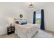 Bright bedroom featuring a large window, neutral decor, and modern light fixture at 3045 Bronwood Pl, Lancaster, SC 29720