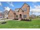 Inviting brick home featuring a manicured lawn and lovely landscaping at 3045 Bronwood Pl, Lancaster, SC 29720