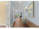 Light-filled hallway showcasing hardwood floors and neutral wall colors at 3045 Bronwood Pl, Lancaster, SC 29720