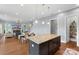 Open-concept kitchen with island and view to the living room and staircase at 3045 Bronwood Pl, Lancaster, SC 29720