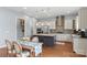 Open kitchen with island, stainless appliances, and adjacent dining area at 3045 Bronwood Pl, Lancaster, SC 29720
