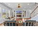 Spacious living room with hardwood floors and access to the staircase and covered deck at 3045 Bronwood Pl, Lancaster, SC 29720