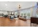 Open living area connecting to kitchen, with hardwood flooring and lots of light at 3045 Bronwood Pl, Lancaster, SC 29720