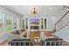 Bright living room with hardwood floors, modern lighting, and backyard views at 3045 Bronwood Pl, Lancaster, SC 29720