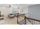Open loft space with a sectional sofa, neutral carpet, and elegant lighting at 3045 Bronwood Pl, Lancaster, SC 29720