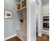 Mudroom featuring a built-in bench, storage, and hardwood floors adjacent to the gourmet kitchen at 3045 Bronwood Pl, Lancaster, SC 29720