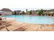 Large outdoor community pool with lounge chairs and umbrellas for relaxation on a sunny day at 3045 Bronwood Pl, Lancaster, SC 29720
