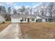 Charming home featuring a driveway, a single car garage and a welcoming front porch at 3604 Oakwood Rd, Charlotte, NC 28269