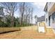 This backyard of a new construction home features a wood fence and a deck with steps down into the yard at 3937 Plainview Rd, Charlotte, NC 28208