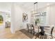 Elegant dining room featuring modern lighting, stylish decor, and natural light at 3937 Plainview Rd, Charlotte, NC 28208