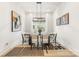 Bright dining room features a large table with seating for six and modern decor at 3937 Plainview Rd, Charlotte, NC 28208
