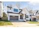 Beautiful two-story home with white siding, black framed windows and a well-manicured lawn at 3937 Plainview Rd, Charlotte, NC 28208
