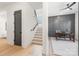 Hallway with a view of a home office featuring board and batten walls at 3937 Plainview Rd, Charlotte, NC 28208