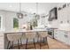 Bright, modern kitchen features a large island with seating and stainless steel appliances at 3937 Plainview Rd, Charlotte, NC 28208