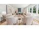Bright and spacious living room with modern decor, fireplace, neutral color palette and large windows at 3937 Plainview Rd, Charlotte, NC 28208