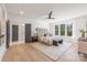 Serene main bedroom with large windows, neutral colors, and an en-suite bathroom at 3937 Plainview Rd, Charlotte, NC 28208