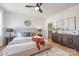 Spacious main bedroom features a ceiling fan, hardwood floors, and stylish decor and furnishings at 3937 Plainview Rd, Charlotte, NC 28208