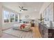 This main bedroom features a neutral palette, large windows, and a plush rug for a cozy and bright retreat at 3937 Plainview Rd, Charlotte, NC 28208