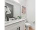 Charming half bath with modern fixtures, sleek vanity, and artistic decor creates an inviting and stylish space at 3949 Plainview Rd, Charlotte, NC 28208