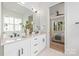 Modern bathroom features double vanities, stone countertops, and ample lighting for a bright, functional space at 3949 Plainview Rd, Charlotte, NC 28208